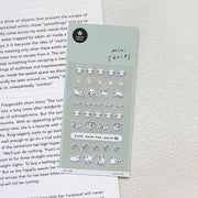 Suatelier Deco.09 cat mini sticker sheet with rows of black and white cat faces, poses, paws, and Cats Save the World text on sage green background, made in South Korea
