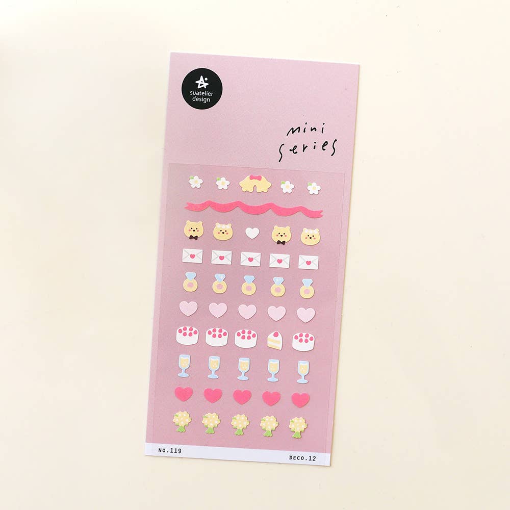 Suatelier Deco.12 love and celebration mini sticker sheet with rows of hearts, love letters, rings, champagne glasses, cake slices, and bouquets on pink background, made in South Korea
