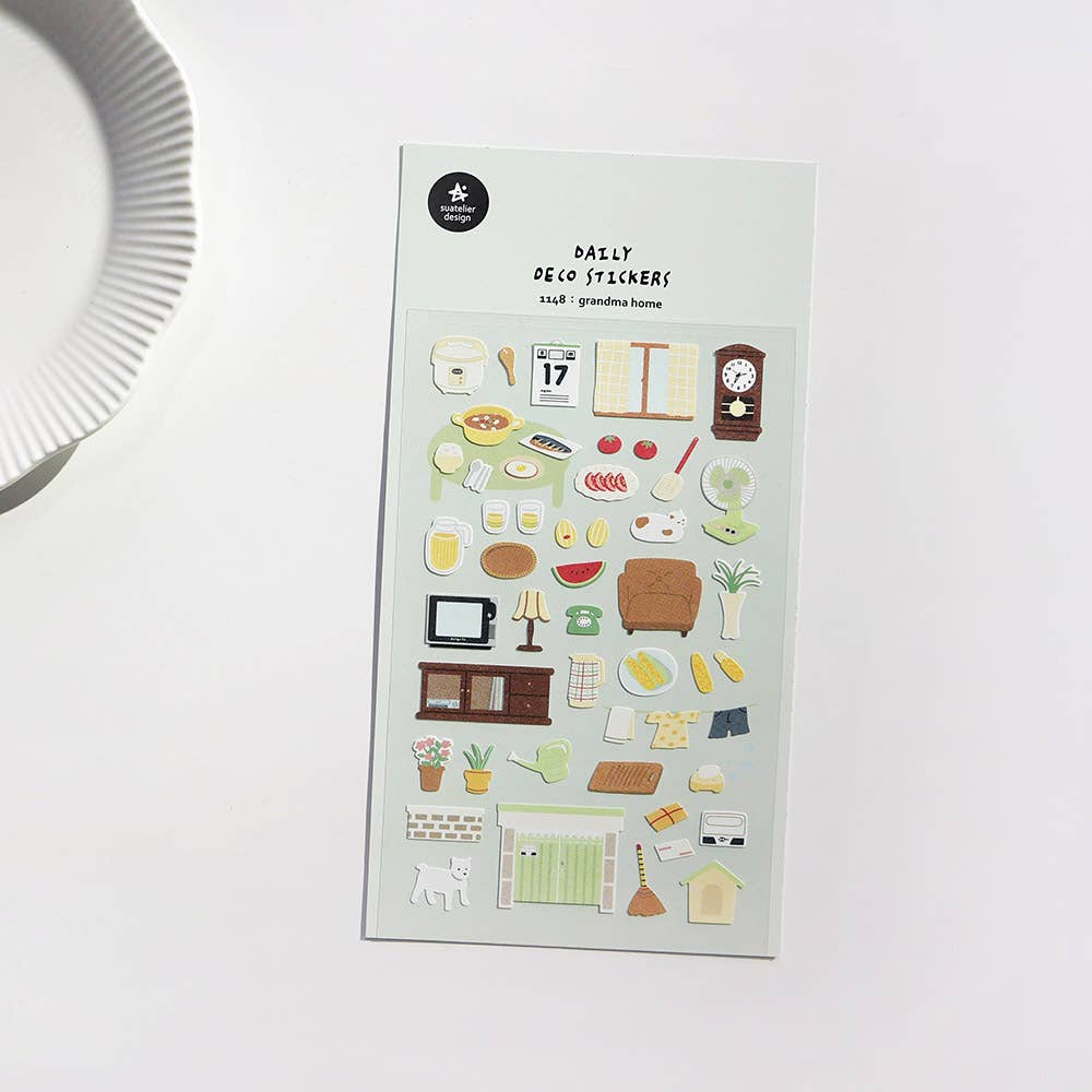 Suatelier Grandma Home cozy deco sticker sheet with hand-drawn home life illustrations including furniture, food, plants, and a dog, made in South Korea