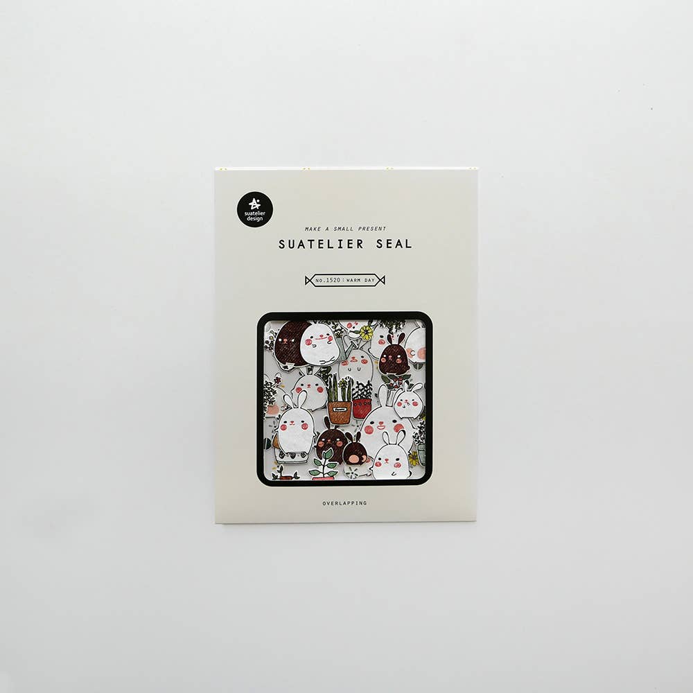 Suatelier Warm Day bunny seal sticker flakes in box showing kawaii round rabbits with flowers and plants in overlapping format, made in South Korea