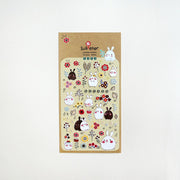 Suatelier Bonny bunny and flower sticker sheet with kawaii round white and brown rabbits among colorful folk flowers on warm yellow background, made in South Korea