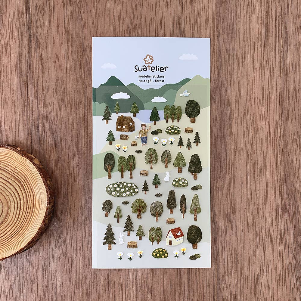 Suatelier Forest woodland scene sticker sheet with illustrated trees, cabins, mountains, rabbits, and flower meadows in green landscape, made in South Korea