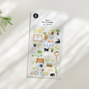 Suatelier A Green Alley garden street deco sticker sheet with illustrated flowers, black cats, bicycle, park bench, awning, and garden plants, made in South Korea