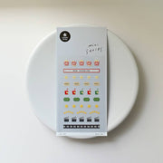 Suatelier Deco.16 movie night mini sticker sheet with rows of popcorn, tickets, sodas, stars, clapperboards, and film strips, made in South Korea