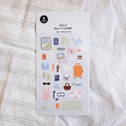 Suatelier Happy Journey travel deco sticker sheet with illustrated vacation items including airplane, passport, luggage, camera, swimsuit, and sunglasses, made in South Korea
