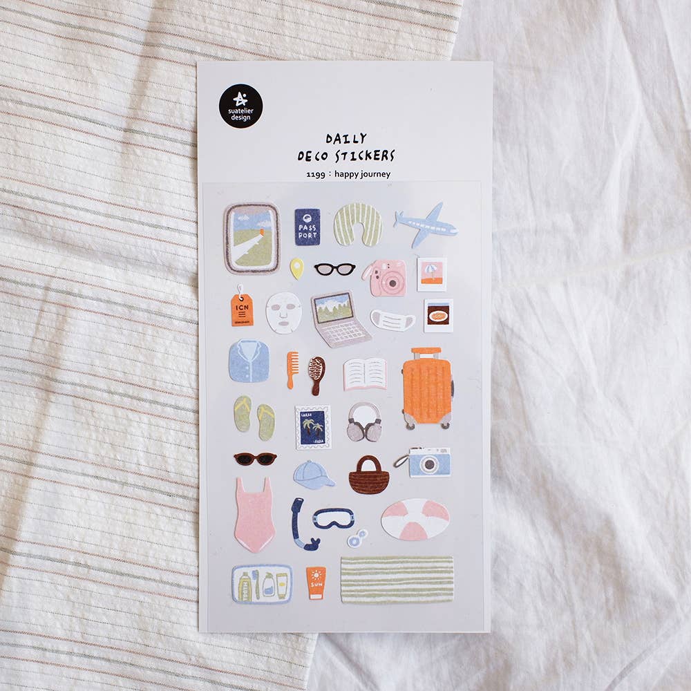 Suatelier Happy Journey travel deco sticker sheet with illustrated vacation items including airplane, passport, luggage, camera, swimsuit, and sunglasses, made in South Korea