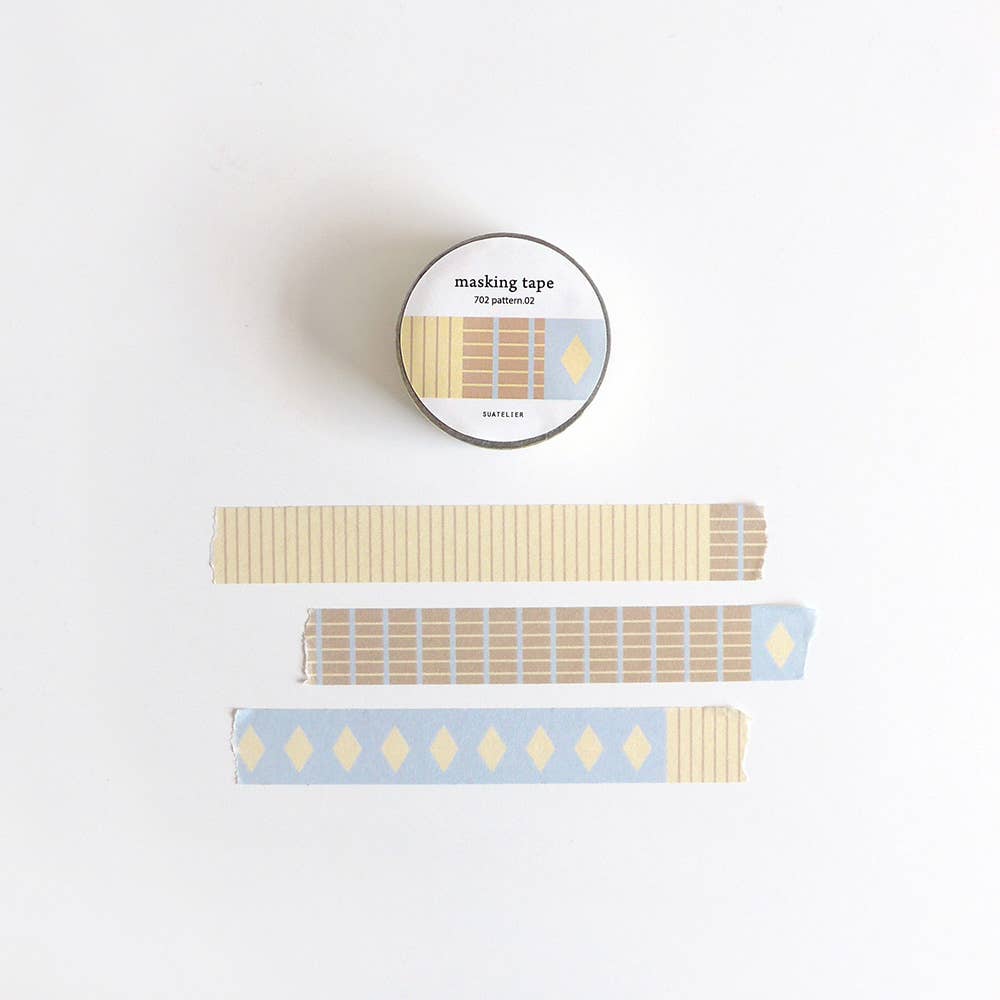Suatelier Pattern.02 geometric washi tape roll showing three patterns: tan vertical stripes, brown grid blocks, and blue with yellow diamonds, made in South Korea