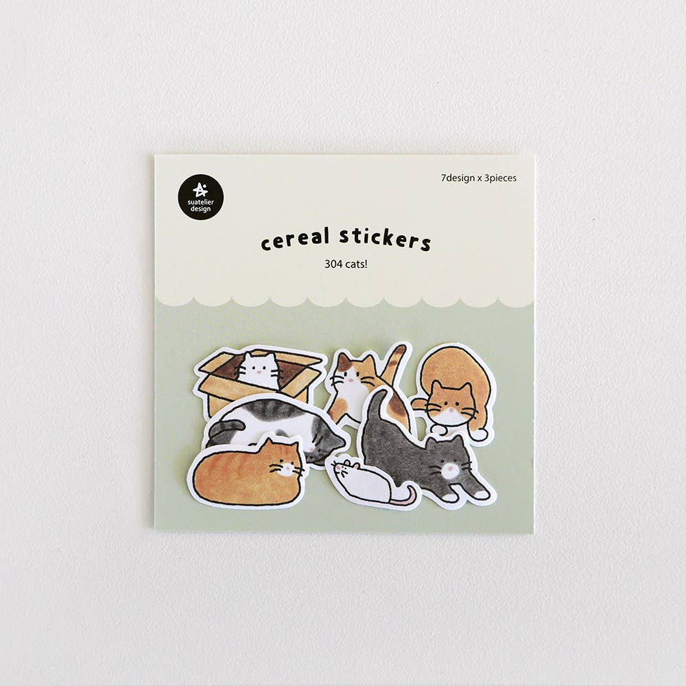 Suatelier Cats! cereal sticker flakes with illustrated cats in various breeds including tabby, tuxedo, and calico, lounging and playing, 7 designs x 3 pieces, made in South Korea