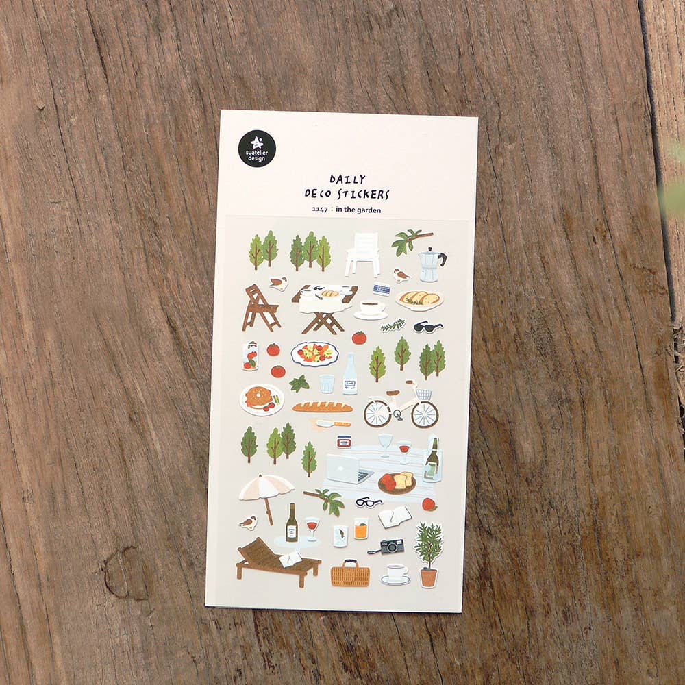 Suatelier In the Garden outdoor dining deco sticker sheet with illustrated European garden party scenes including wine, baguette, moka pot, bicycle, lounge chair, and parasol, made in South Korea