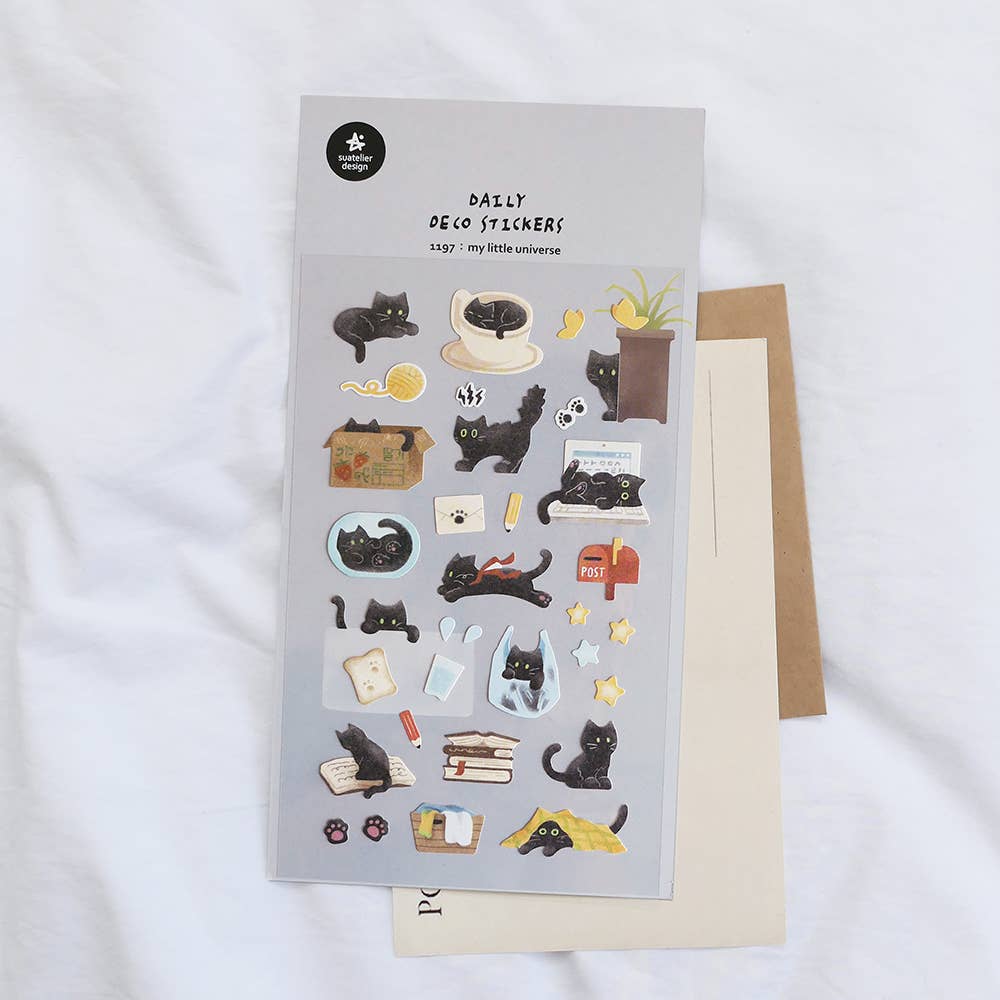 Suatelier My Little Universe black cat deco sticker sheet with illustrated black cat in daily life scenes including coffee cup, books, and mailbox, made in South Korea