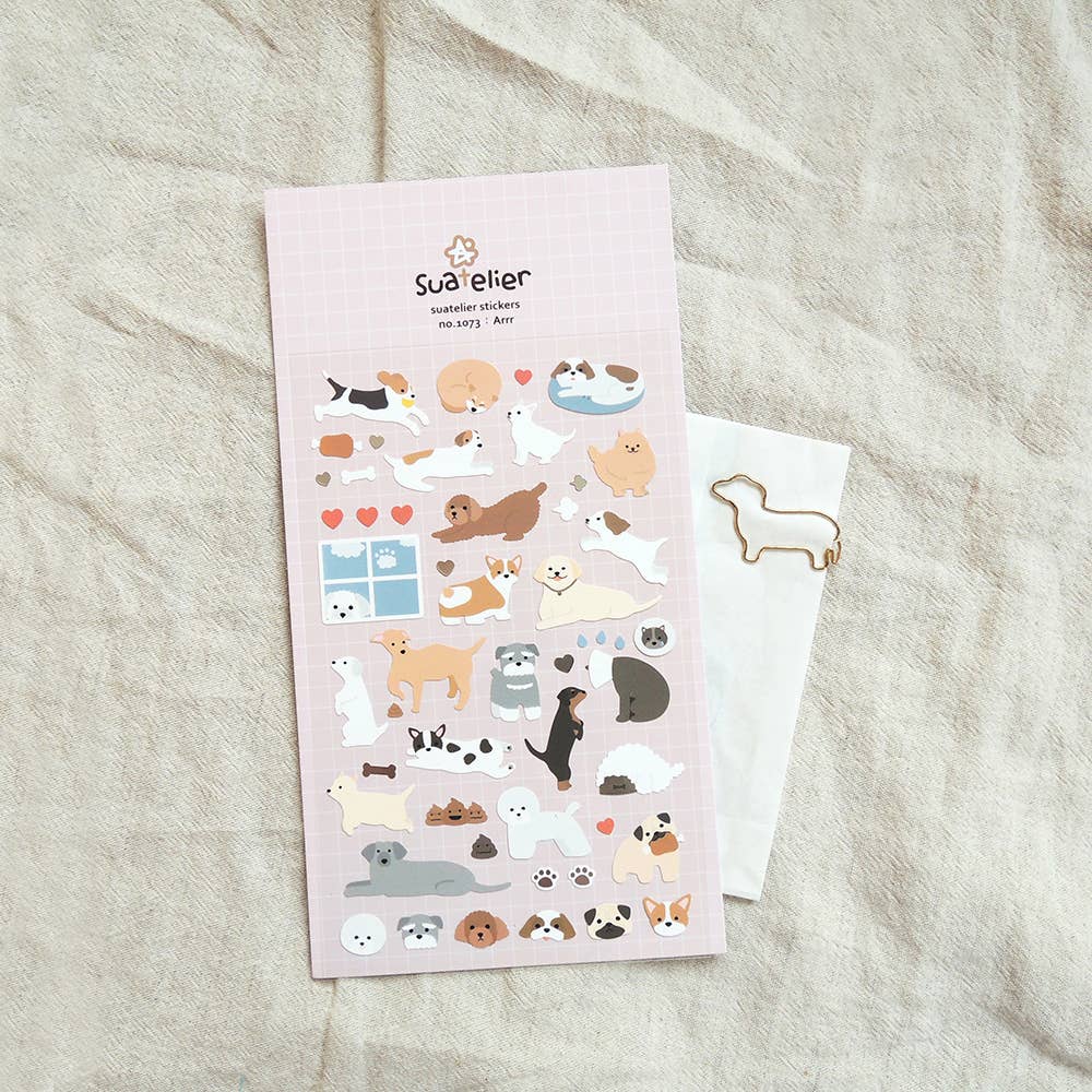 Suatelier Arrr dog breed sticker sheet with illustrated corgi, poodle, dachshund, beagle, pomeranian, pug, and more on pink grid background, made in South Korea